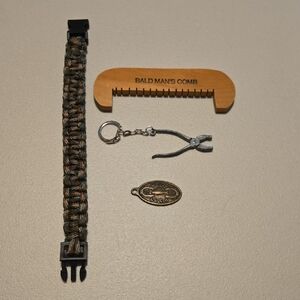 A Paracord bracelet,  "bald man"comb, Pliers keychain, "Good Luck" keyring charm